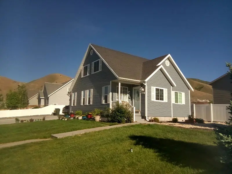 Blue house with new siding