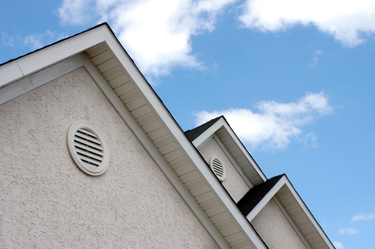 Close up of home with offwhite stucco