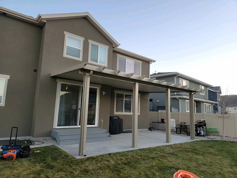 Pergola attached to tan stucco home