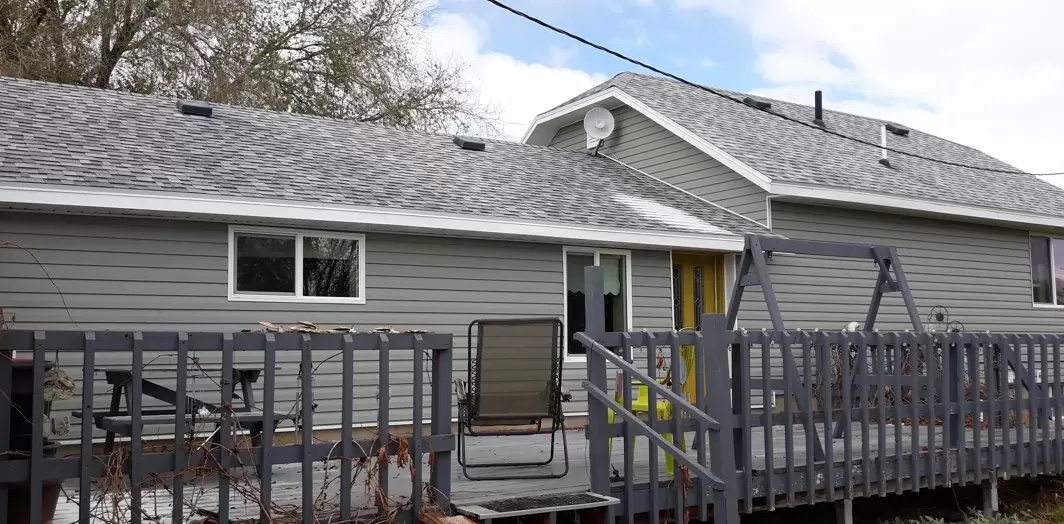 Tudor style split level home after new siding